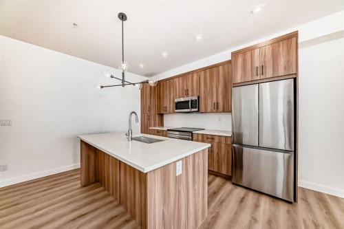 8202-1802 Mahogany Boulevard Se, Calgary, AB - Indoor Photo Showing Kitchen With Stainless Steel Kitchen