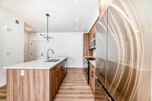 8202-1802 Mahogany Boulevard Se, Calgary, AB - Indoor Photo Showing Kitchen With Upgraded Kitchen