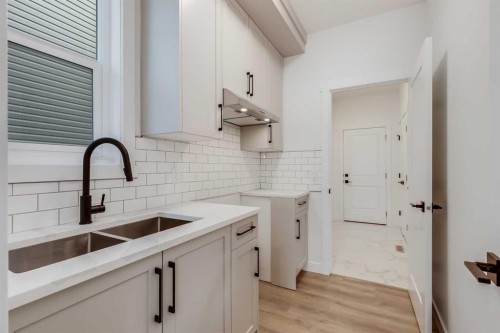 460 Rivercrest View, Cochrane, AB - Indoor Photo Showing Kitchen With Double Sink
