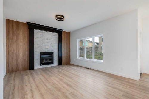 460 Rivercrest View, Cochrane, AB - Indoor Photo Showing Living Room With Fireplace