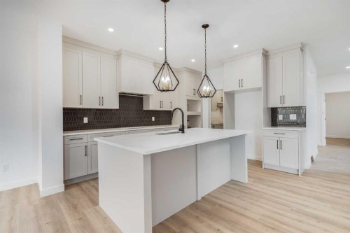 460 Rivercrest View, Cochrane, AB - Indoor Photo Showing Kitchen With Upgraded Kitchen