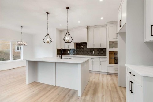 460 Rivercrest View, Cochrane, AB - Indoor Photo Showing Kitchen With Upgraded Kitchen