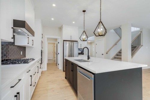 468 Rivercrest View, Cochrane, AB - Indoor Photo Showing Kitchen With Double Sink With Upgraded Kitchen