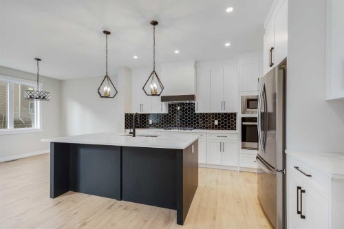 468 Rivercrest View, Cochrane, AB - Indoor Photo Showing Kitchen With Stainless Steel Kitchen With Upgraded Kitchen