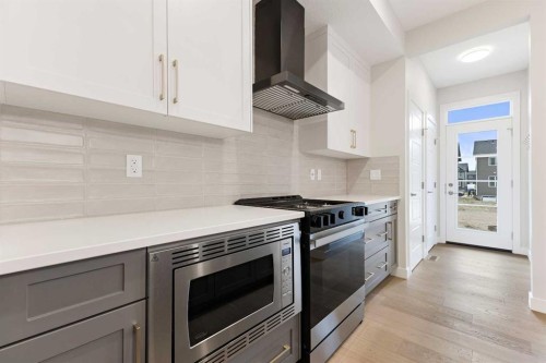 430 River Avenue, Cochrane, AB - Indoor Photo Showing Kitchen With Upgraded Kitchen