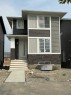 430 River Avenue, Cochrane, AB  - Outdoor With Facade 