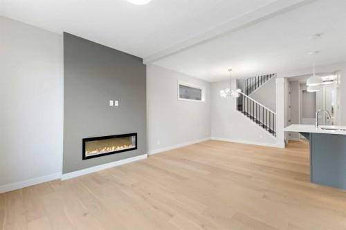 430 River Avenue, Cochrane, AB - Indoor Photo Showing Living Room With Fireplace