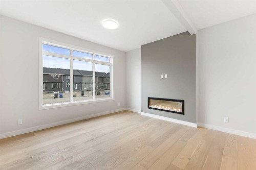 430 River Avenue, Cochrane, AB - Indoor Photo Showing Living Room With Fireplace