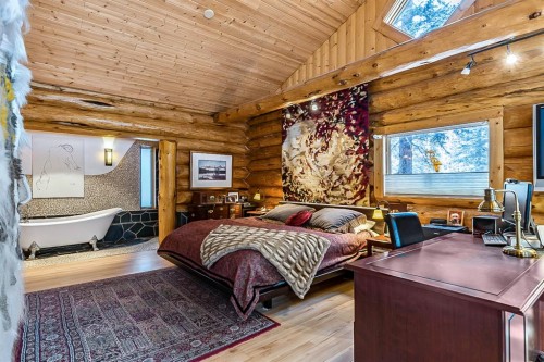 104 White Avenue, Bragg Creek, AB - Indoor Photo Showing Bedroom