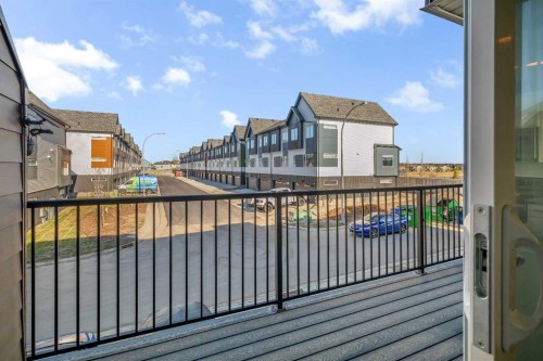 404-1530 Bayside Avenue Sw, Airdrie, AB - Outdoor With Balcony With Exterior