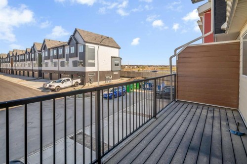404-1530 Bayside Avenue Sw, Airdrie, AB - Outdoor With Balcony With Exterior