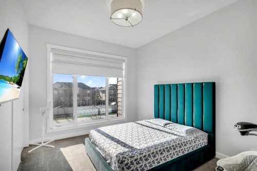 404-1530 Bayside Avenue Sw, Airdrie, AB - Indoor Photo Showing Bedroom