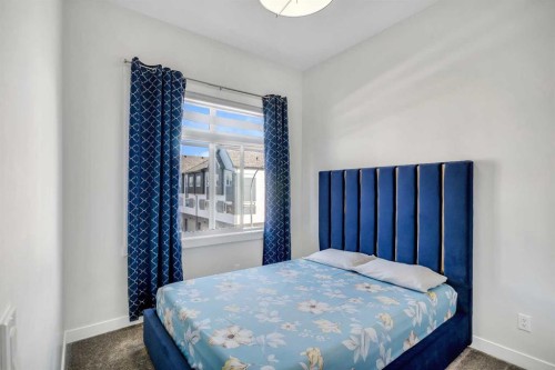 404-1530 Bayside Avenue Sw, Airdrie, AB - Indoor Photo Showing Bedroom