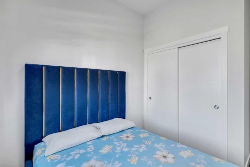 404-1530 Bayside Avenue Sw, Airdrie, AB - Indoor Photo Showing Bedroom