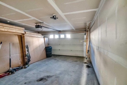 404-1530 Bayside Avenue Sw, Airdrie, AB - Indoor Photo Showing Garage
