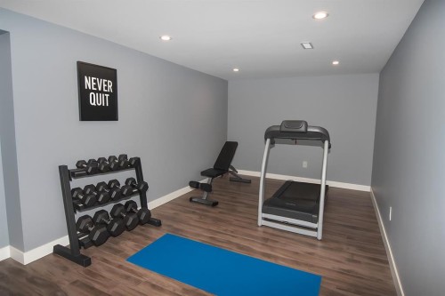 106 Eldorado Road Se, Airdrie, AB - Indoor Photo Showing Gym Room
