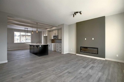 434 River Avenue, Cochrane, AB - Indoor Photo Showing Living Room With Fireplace