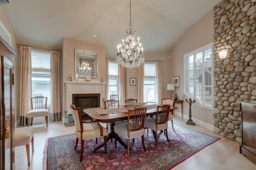 107 Lougheed Circle, Banff, AB - Indoor Photo Showing Dining Room With Fireplace