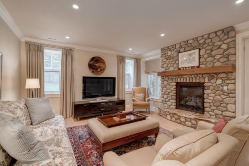 107 Lougheed Circle, Banff, AB - Indoor Photo Showing Living Room With Fireplace