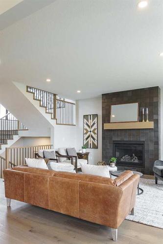 329 Limestone Bay, Balzac, AB - Indoor Photo Showing Living Room With Fireplace