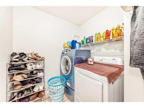 158 Panamount Drive Nw, Calgary, AB - Indoor Photo Showing Laundry Room