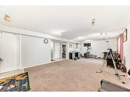 158 Panamount Drive Nw, Calgary, AB - Indoor Photo Showing Gym Room