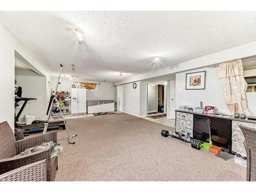 158 Panamount Drive Nw, Calgary, AB - Indoor Photo Showing Gym Room