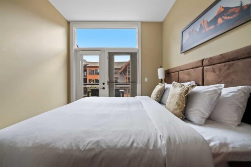 407-187 Kananaskis Way, Canmore, AB - Indoor Photo Showing Bedroom