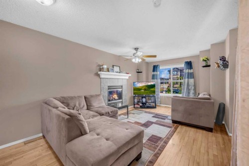 6 Saddlemont Way Ne, Calgary, AB - Indoor Photo Showing Living Room With Fireplace