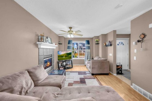 6 Saddlemont Way Ne, Calgary, AB - Indoor Photo Showing Living Room With Fireplace