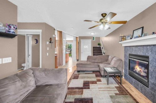 6 Saddlemont Way Ne, Calgary, AB - Indoor Photo Showing Living Room With Fireplace