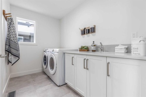 84 Emberside Green, Cochrane, AB - Indoor Photo Showing Laundry Room