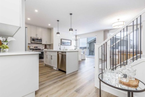 84 Emberside Green, Cochrane, AB - Indoor Photo Showing Kitchen With Upgraded Kitchen