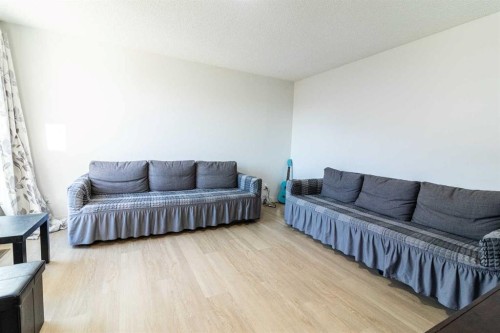 78-1155 Falconridge Drive Ne, Calgary, AB - Indoor Photo Showing Living Room