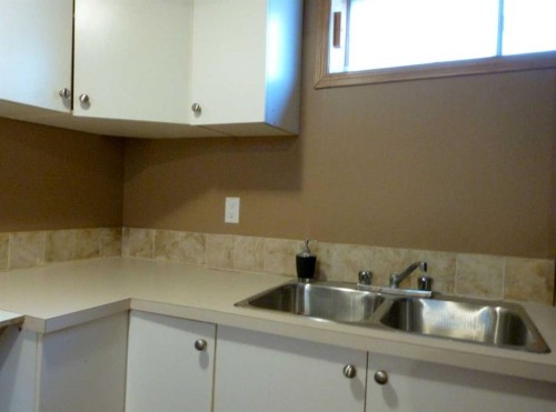 34 Martinridge Road Ne, Calgary, AB - Indoor Photo Showing Kitchen With Double Sink