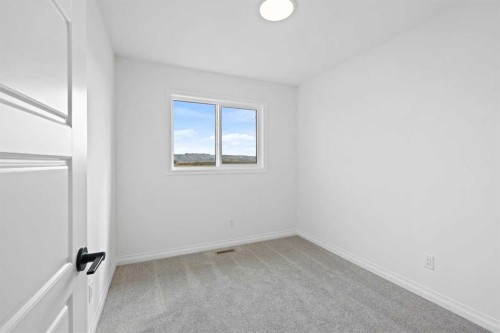 902 Wolf Willow Boulevard Se, Calgary, AB - Indoor Photo Showing Other Room