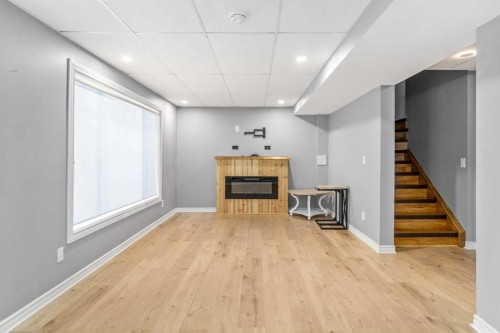 181 Hidden Creek Gardens Nw, Calgary, AB - Indoor With Fireplace