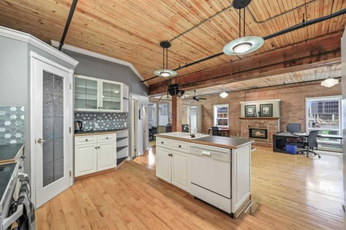 401-535 10 Avenue Sw, Calgary, AB - Indoor Photo Showing Kitchen With Fireplace With Double Sink