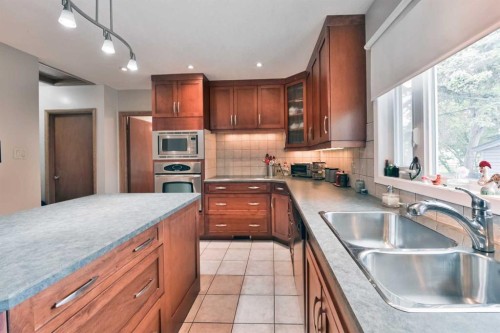 5712 Layzell Road Sw, Calgary, AB - Indoor Photo Showing Kitchen With Double Sink