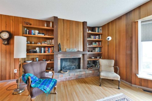 5712 Layzell Road Sw, Calgary, AB - Indoor With Fireplace