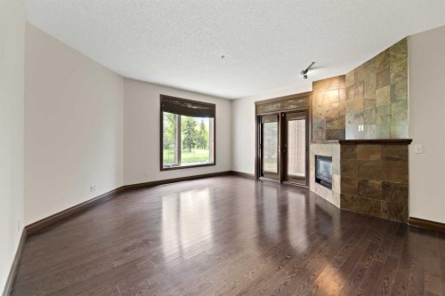 2108-24 Hemlock Crescent Sw, Calgary, AB - Indoor Photo Showing Other Room With Fireplace