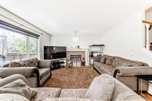 45 Shawbrooke Park Sw, Calgary, AB - Indoor Photo Showing Living Room With Fireplace