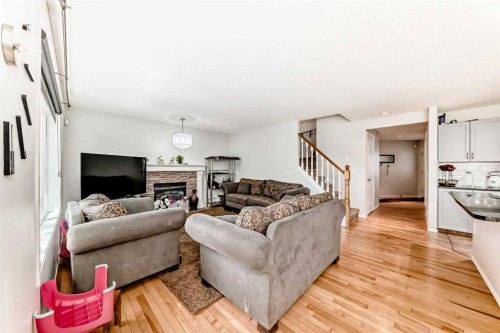45 Shawbrooke Park Sw, Calgary, AB - Indoor Photo Showing Living Room With Fireplace
