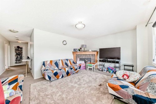 45 Shawbrooke Park Sw, Calgary, AB - Indoor With Fireplace