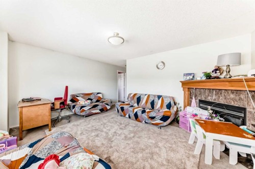 45 Shawbrooke Park Sw, Calgary, AB - Indoor With Fireplace