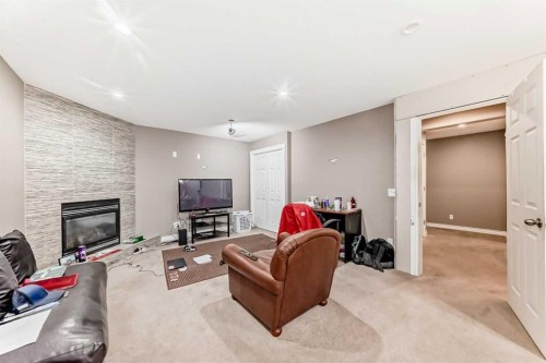 45 Shawbrooke Park Sw, Calgary, AB - Indoor Photo Showing Living Room With Fireplace