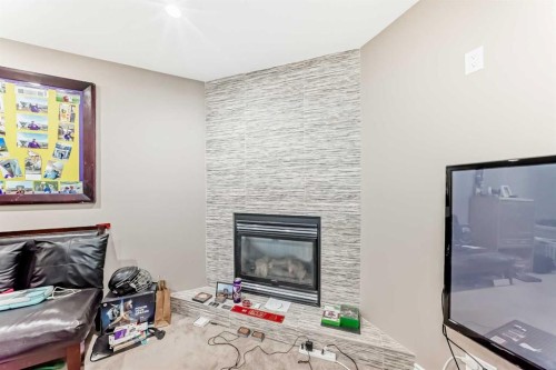 45 Shawbrooke Park Sw, Calgary, AB - Indoor Photo Showing Living Room With Fireplace