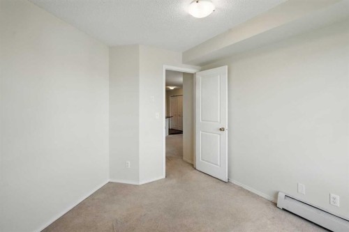 409-15 Saddlestone Way Ne, Calgary, AB - Indoor Photo Showing Other Room
