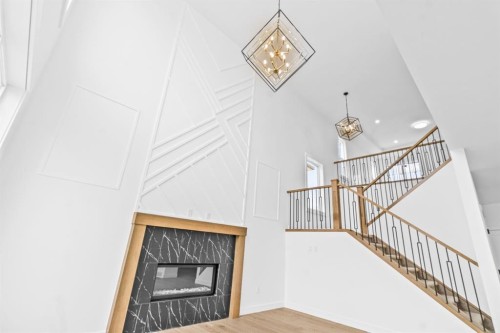 8 Ranchers Meadows, Okotoks, AB - Indoor Photo Showing Other Room With Fireplace