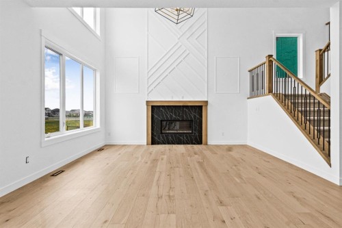 8 Ranchers Meadows, Okotoks, AB - Indoor Photo Showing Living Room With Fireplace